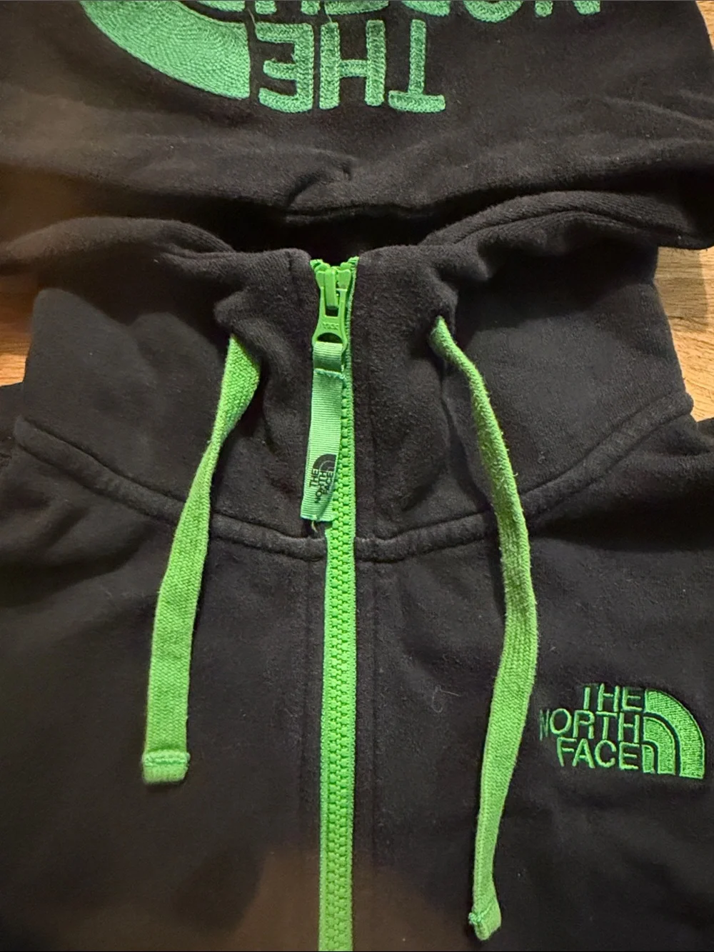 The North Face Black Hoodie with Green Accents